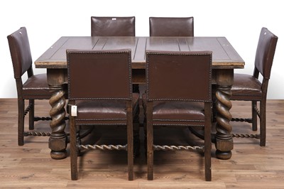 Lot 49 - A set of six oak and leather dining chairs; and a carved oak draw leaf dining table