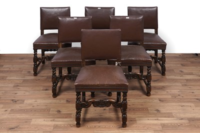 Lot 49 - A set of six oak and leather dining chairs; and a carved oak draw leaf dining table