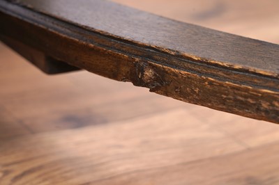 Lot 49 - A set of six oak and leather dining chairs; and a carved oak draw leaf dining table