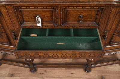 Lot 107 - An early 20th Century Lees style carved oak sideboard