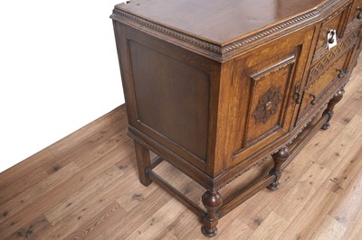 Lot 107 - An early 20th Century Lees style carved oak sideboard