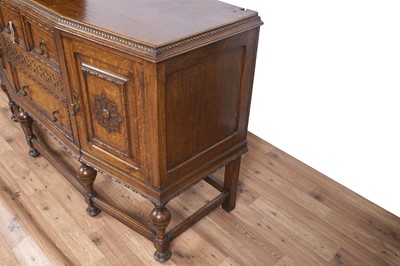 Lot 107 - An early 20th Century Lees style carved oak sideboard