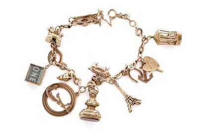 Lot 10 - A yellow gold charm bracelet