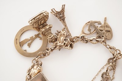 Lot 10 - A yellow gold charm bracelet