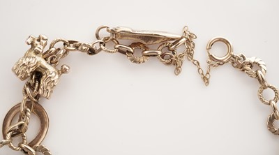 Lot 10 - A yellow gold charm bracelet