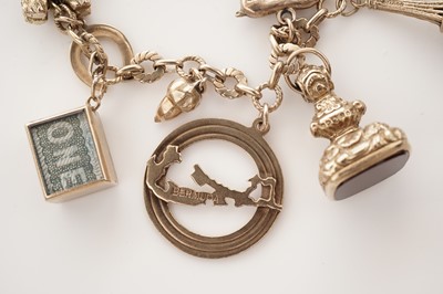 Lot 10 - A yellow gold charm bracelet
