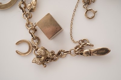 Lot 10 - A yellow gold charm bracelet