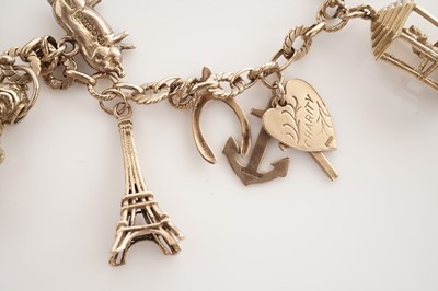 Lot 10 - A yellow gold charm bracelet