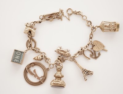 Lot 10 - A yellow gold charm bracelet
