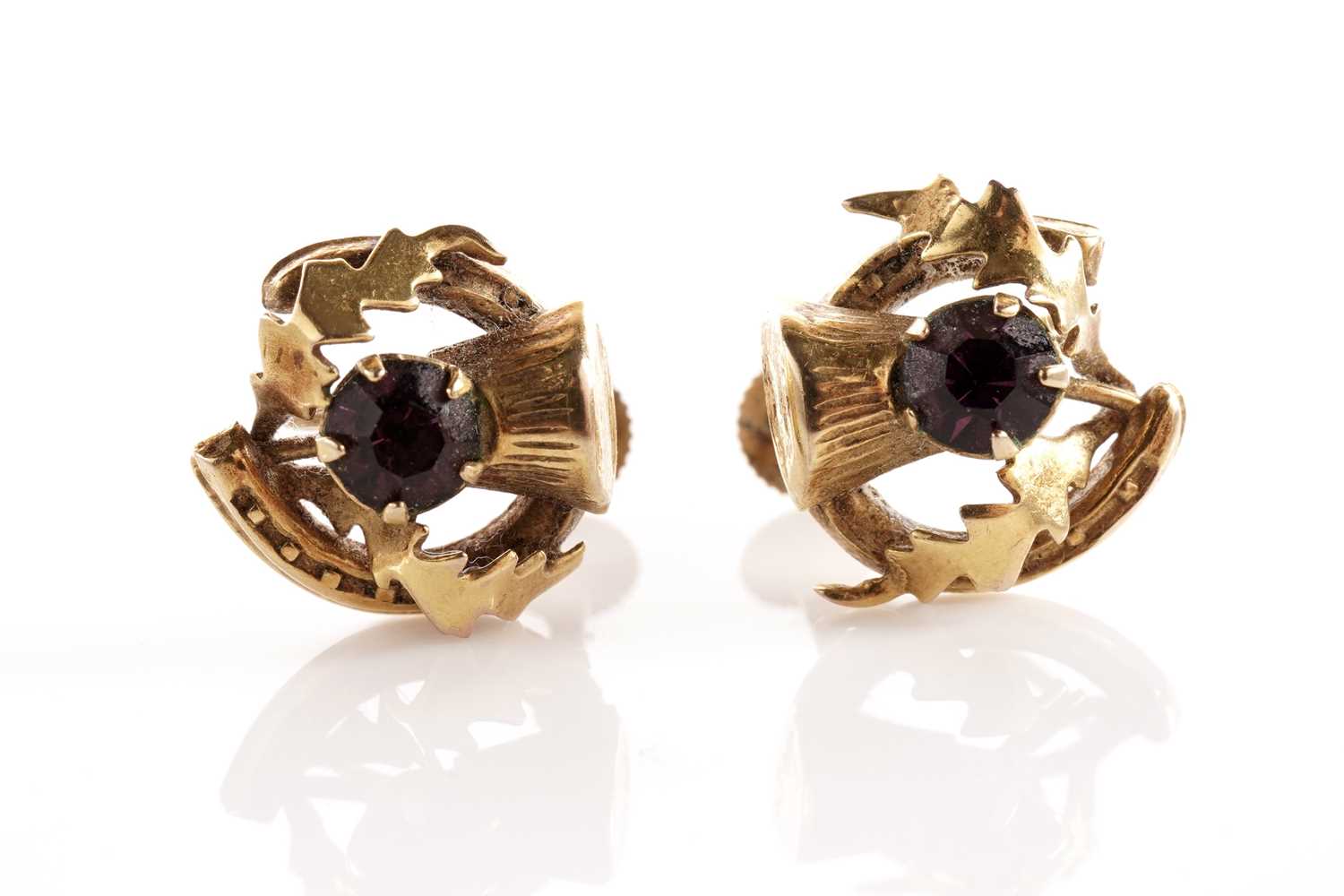 Lot 50 - A pair of thistle pattern screw back earrings