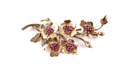 Lot 58 - A pink sapphire flower pattern brooch