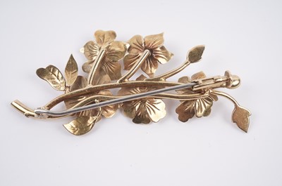 Lot 58 - A pink sapphire flower pattern brooch