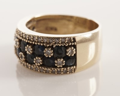 Lot 70 - A sapphire and diamond dress ring