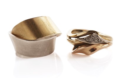 Lot 90 - A diamond dress ring; together with an abstract silver dress ring