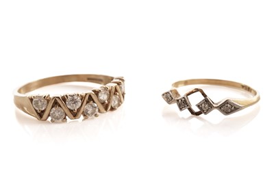 Lot 88 - A diamond four stone ring; and another ring