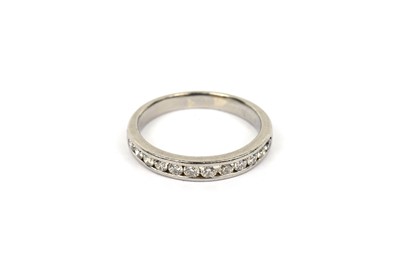 Lot 729 - A diamond half hoop eternity ring