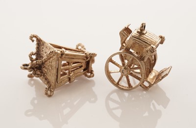 Lot 20 - A collection of 9ct yellow gold charms; with a gilt metal charm