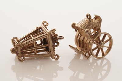 Lot 20 - A collection of 9ct yellow gold charms; with a gilt metal charm