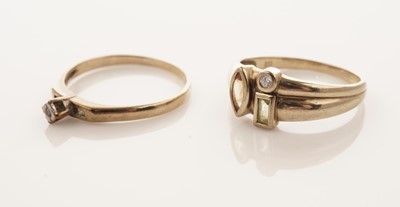 Lot 26 - A coloured gemstone set ring; and a solitaire diamond ring