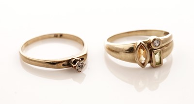 Lot 26 - A coloured gemstone set ring; and a solitaire diamond ring