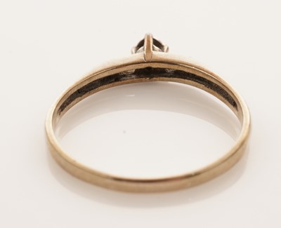 Lot 26 - A coloured gemstone set ring; and a solitaire diamond ring