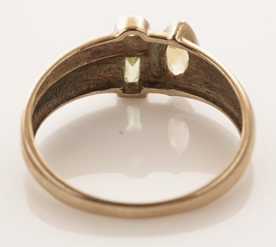 Lot 26 - A coloured gemstone set ring; and a solitaire diamond ring