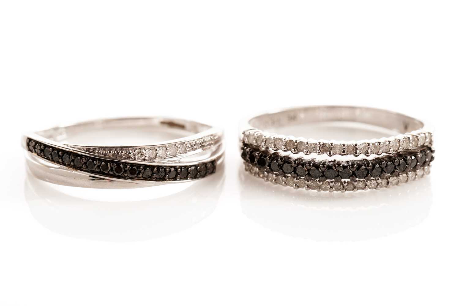 Lot 105 - Two diamond and black diamond rings