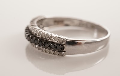 Lot 105 - Two diamond and black diamond rings