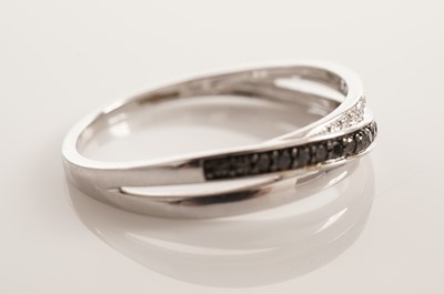 Lot 105 - Two diamond and black diamond rings