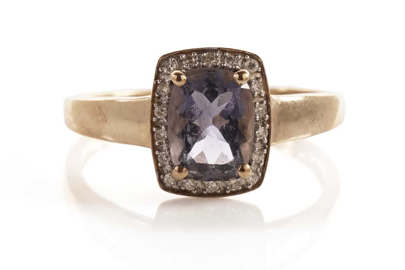 Lot 107 - An iolite and diamond cluster dress ring