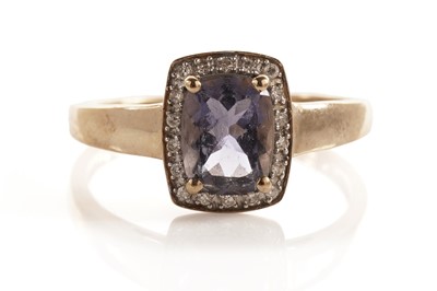 Lot 107 - An iolite and diamond cluster dress ring