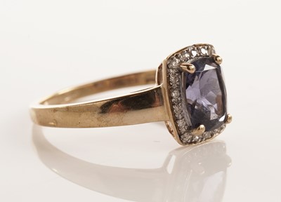 Lot 107 - An iolite and diamond cluster dress ring