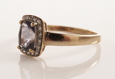 Lot 107 - An iolite and diamond cluster dress ring