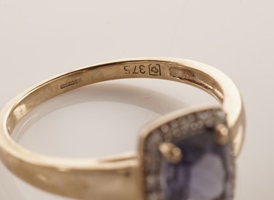 Lot 107 - An iolite and diamond cluster dress ring