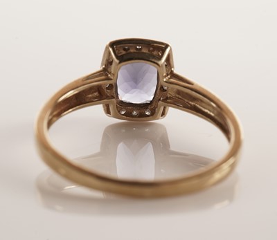 Lot 107 - An iolite and diamond cluster dress ring