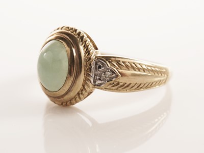 Lot 109 - A jadeite and diamond dress ring