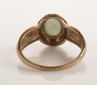 Lot 109 - A jadeite and diamond dress ring