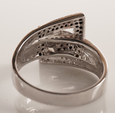 Lot 119 - A diamond and black diamond dress ring