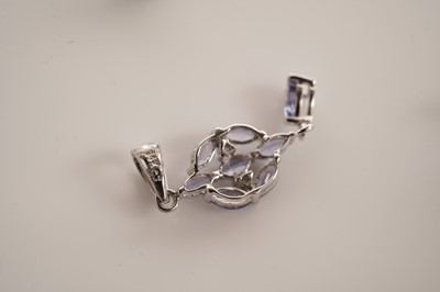 Lot 130 - A tanzanite and diamond pendant; and a pair of tanzanite earrings