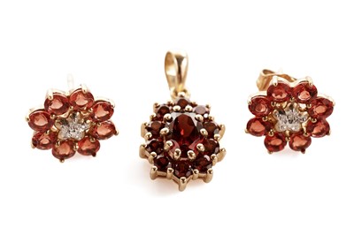 Lot 132 - A pair of garnet and diamond earrings; and a garnet pendant
