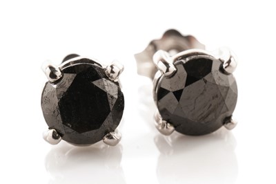 Lot 152 - A pair of black diamond stud earrings