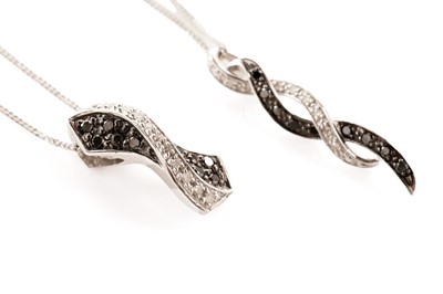 Lot 157 - Two diamond and black diamond twist pendant necklaces