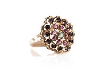Lot 138 - A sapphire, ruby and emerald cluster ring