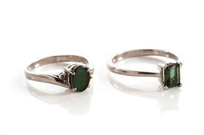 Lot 137 - A green tourmaline single stone ring; and another ring