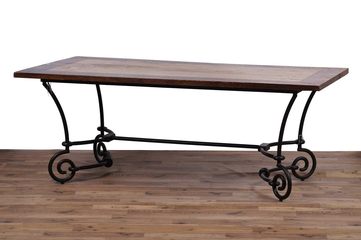 Lot 110 - A modern oak and wrought metal dining table