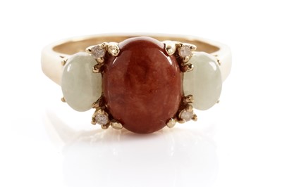 Lot 143 - A jadeite and diamond dress ring