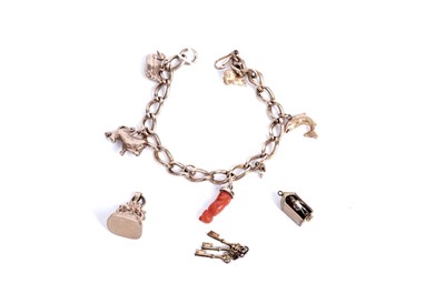 Lot 168 - A rose gold charm bracelet
