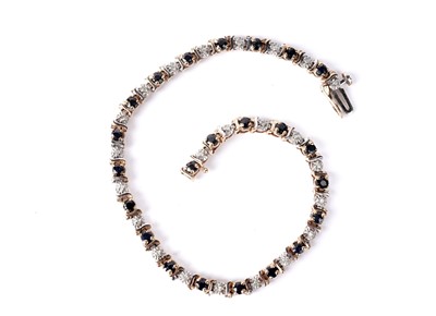 Lot 903 - A sapphire and diamond tennis bracelet