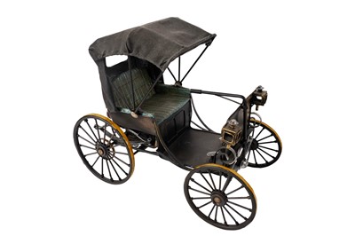Lot 155 - ﻿A diecast model of an 1893 Duryea motor carriage; and another similar
