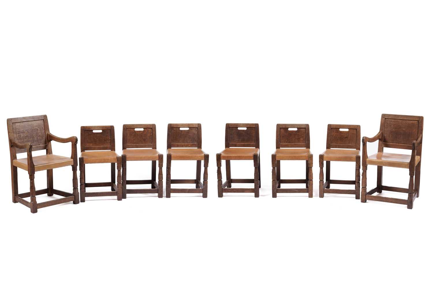 Lot 15 - Robert ‘Mouseman’ Thompson of Kilburn: a set of eight rare oak and leather panel back dining chairs